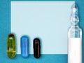 Drug prescription form as a white paper and set of medicament Ã¢â¬â colorful capsules and glass ampule. Chemist, drugstore, clinic Royalty Free Stock Photo